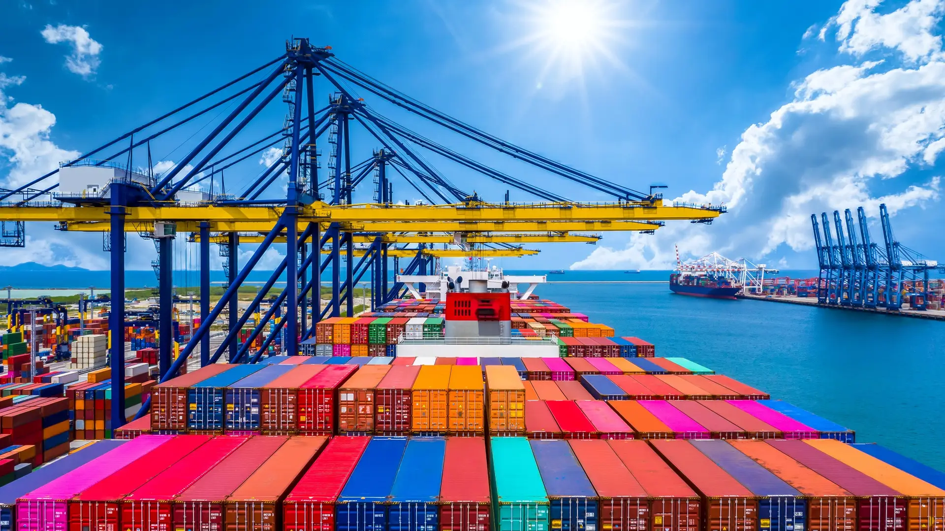 Container ship loaded with shipping containers at a port terminal