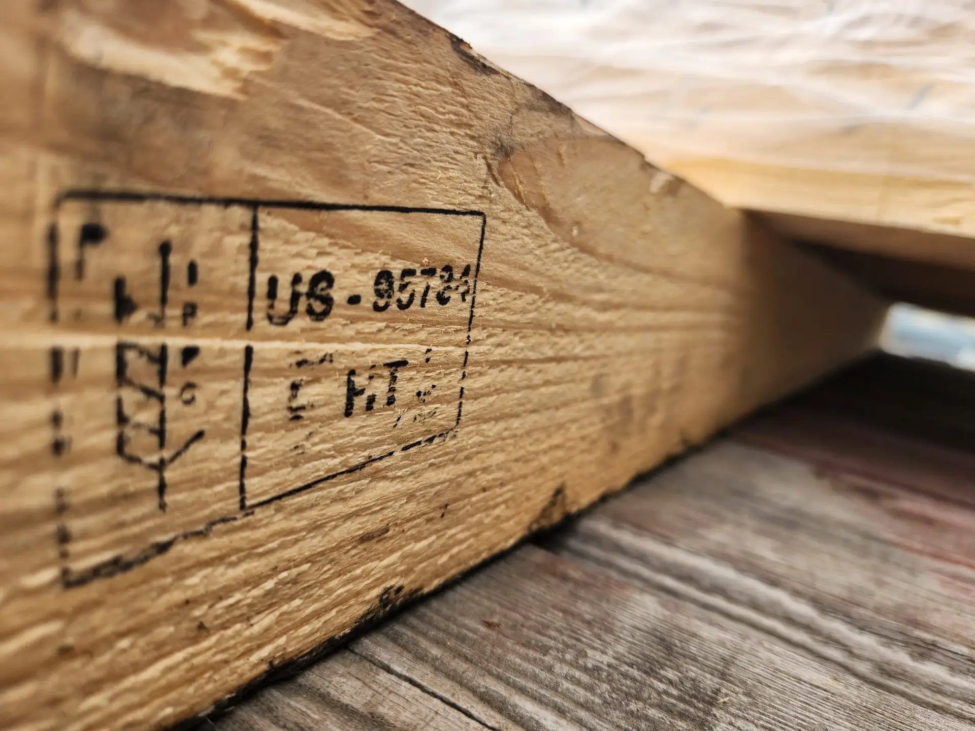 Heat-treated export packing timber stamped and marked with its treatment code, ready for international shipment