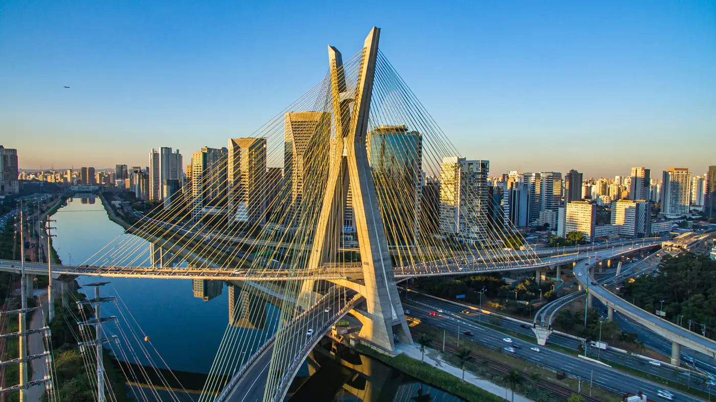 Aerial view of Sao Paulo at sunset with the city landmark cable-stayed bridge, one of two standard delivery areas on the Miami to Brazil lane