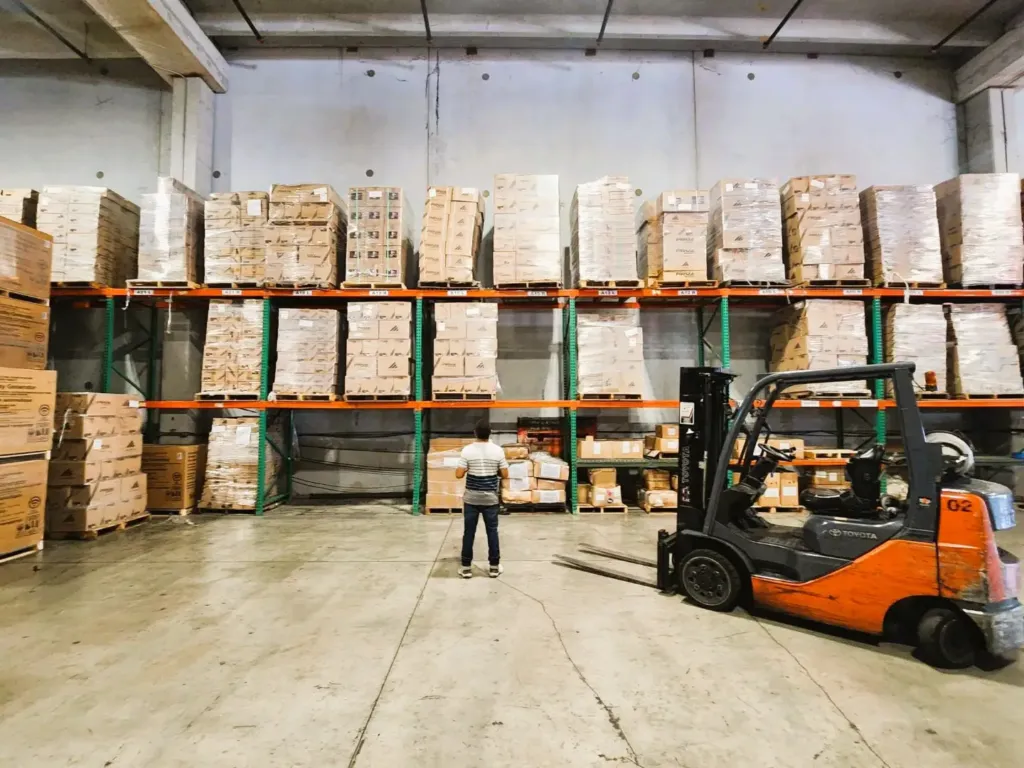 Forklift working between racked pallets inside the EFI bonded warehouse in Medley, Miami