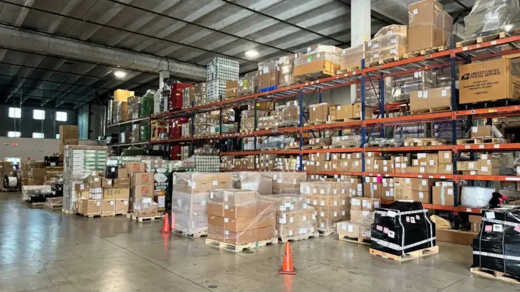 Palletized cargo in racked storage bays inside the Miami warehouse