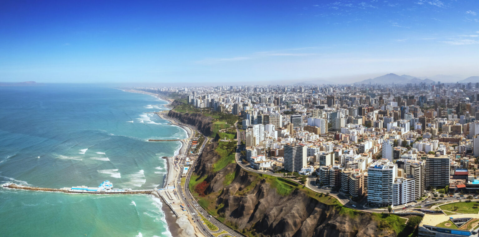 Aerial panorama of Lima’s Costa Verde coastline at golden hour