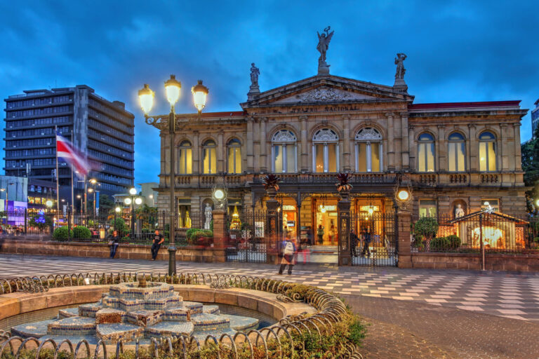 The National Theatre of Costa Rica in San José at dusk, lit from inside